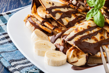 Crepes with banana and chocolate cream