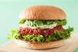 vegan beet and quinoa burger with avocado dressing