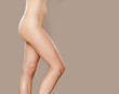 © vladimirfloyd - pretty female legs and waist on a gray background