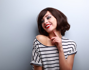 Happy natural laughing young short hairstyle woman in fashion bl