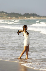 Poster - Young girl walking on the beach in Algarve, Portugal, Europe