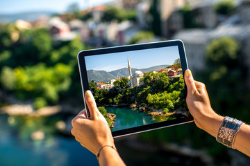 Wall Mural - Photographing with digital tablet Mostar city