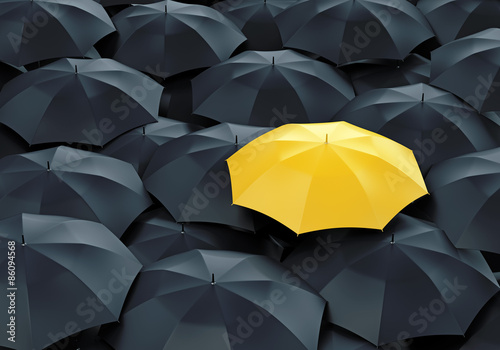 Cuadros en Lienzo Yellow umbrella among dark ones