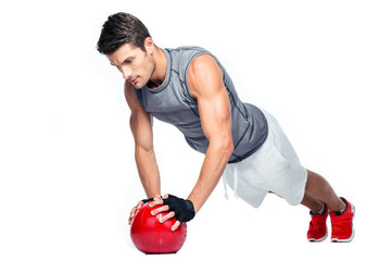 Sports man working out with fitness ball