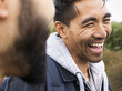 © Mint Images - Close up of two young men laughing outdoors
