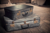 Fototapeta  - Photo of old vintage suitcases in a dusty attic, travel and nostalgia concept