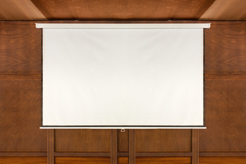 empty projector screen on wooden wall