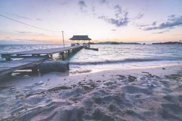 Wall Mural - Tourist beach resort at dawn, marsala toned image