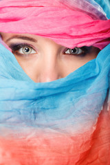 Wall Mural - woman makeup on eyes hiden her face with shawl