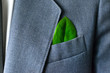 The businessman's photo in a suit with a leaf in a pocket