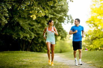 Young couple running