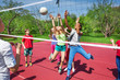 © Sergey Novikov - Happy teenage kids play volleyball outside