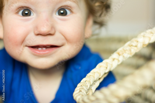 Funny baby playing with toys at home Poster Mural XXL