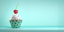 Delicious Cupcake Topped With A Cherry With Whipped Cream And Sweeties. The Cherry On The Cake Metaphor. Copy Space.