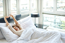 Woman Sitting In Bed