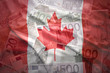 colorful waving canadian flag on a euro money background