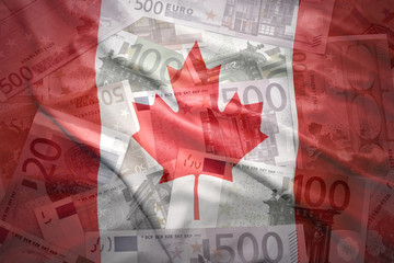 Wall Mural - colorful waving canadian flag on a euro money background