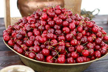 dish with fresh cherries closeup