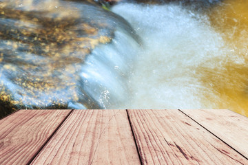 close-up beautiful waterfall in deep forest and wood pier at Chi