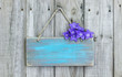 Blank rustic teal blue sign with purple balloon flowers