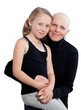 Studio portrait on white of a bald mother fighting breast cancer with her young daughter.