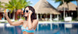 © Syda Productions - woman in swimsuit taking selfie with smatphone