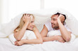 © Syda Productions - happy couple lying in bed and talking at home