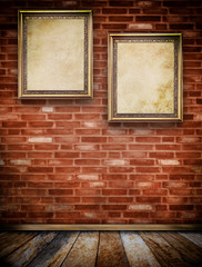 Two old wooden frames on bricks wall.