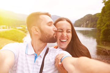 Wall Mural - happy couple taking selfie