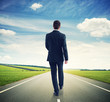 © ArtFamily - walking businessman on the road