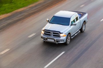 Wall Mural - pickup goes on highway