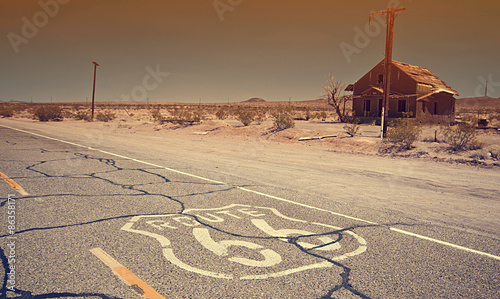 Photo Route 66 pavement sign sunrise in California's Mojave desert.