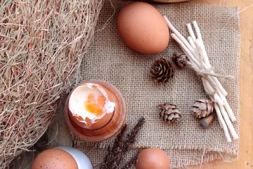 Poster - soft-boiled egg and eggs on wood background