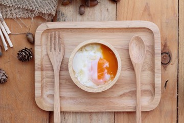 Wall Mural - soft-boiled egg and eggs on wood background