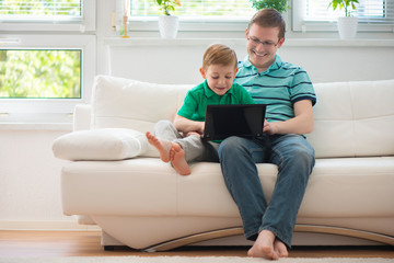 Wall Mural - Happy father and child playing at home