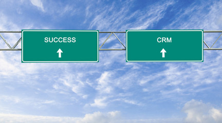 Wall Mural - Road sign to CRM and commerce