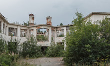 Abandoned Building Overgrown With Vegetation