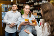 © JackF - Two girls with man at bar