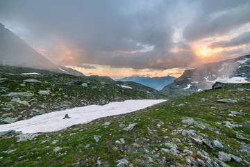 Wall Mural - High altitude alpine landscape and cloudscape at sunset