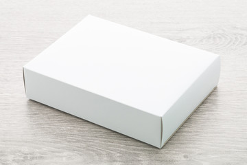 Poster - Paper box on wood background