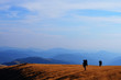 © natiandru - two backpackers hiking in mountains