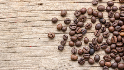 Wall Mural - Background with coffee beans and wood texture