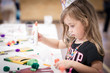 © zoeytoja - little girl making handcraft at a table