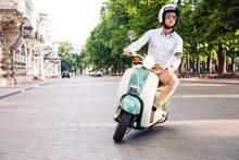 Fashion Man Driving A Scooter