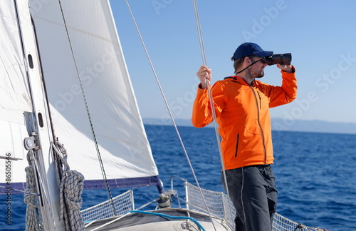 Fotografie, Obraz Man sailing with sails out on a sunny day