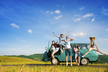 Wall Mural - Young hipster friends on road trip