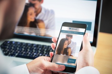 Poster - Composite image of businessman using smartphone