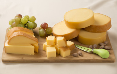 Wall Mural - Different cheeses on a cutting board, delicious food