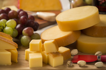 Wall Mural - Different cheeses on a cutting board, delicious food