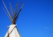 Native American Tipi And Moon In A Blue Sky